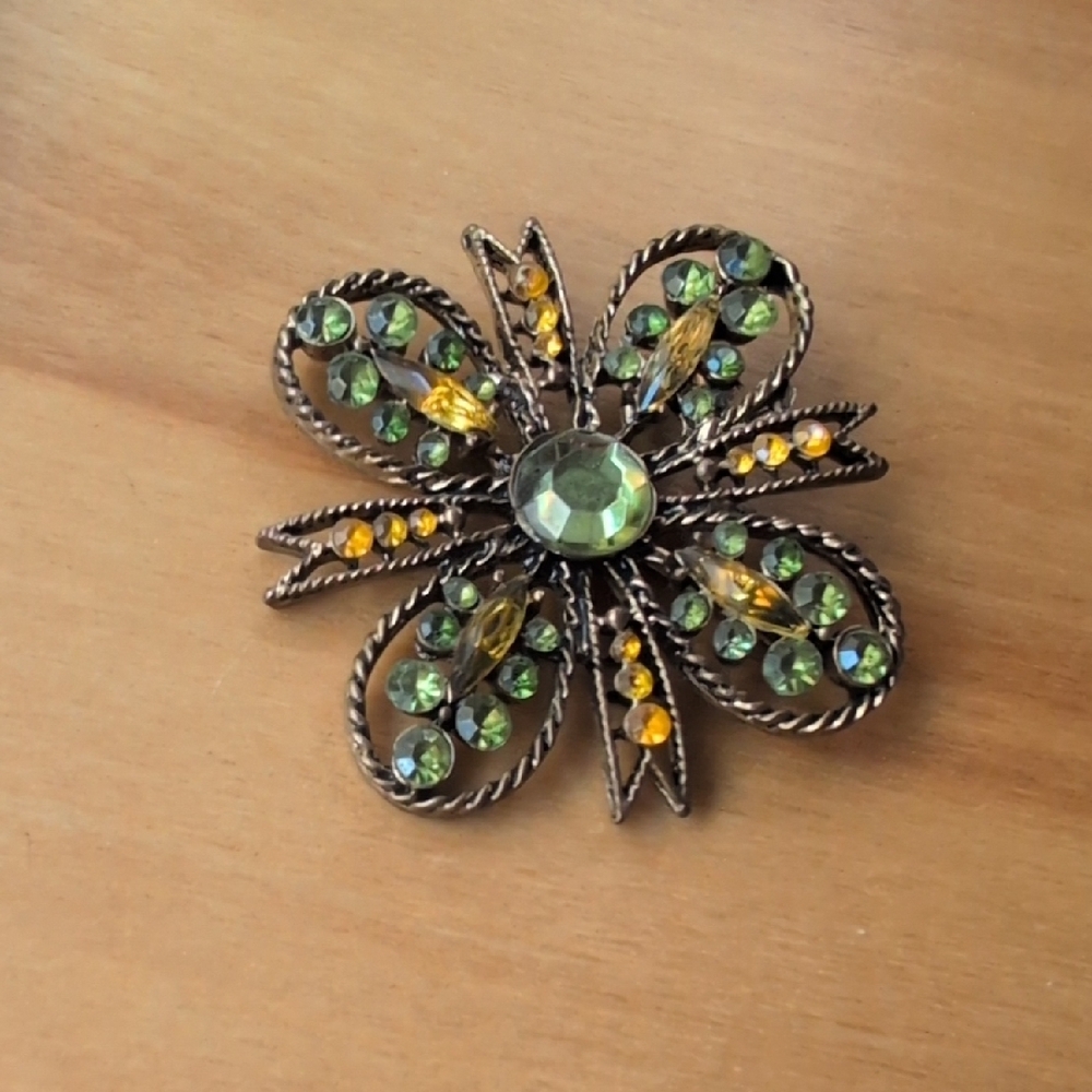 Vintage Style Floral Brooch with Green and Orange Accents